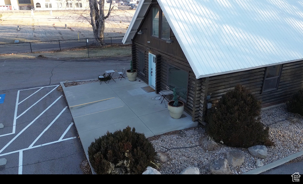 View of side of home featuring a patio