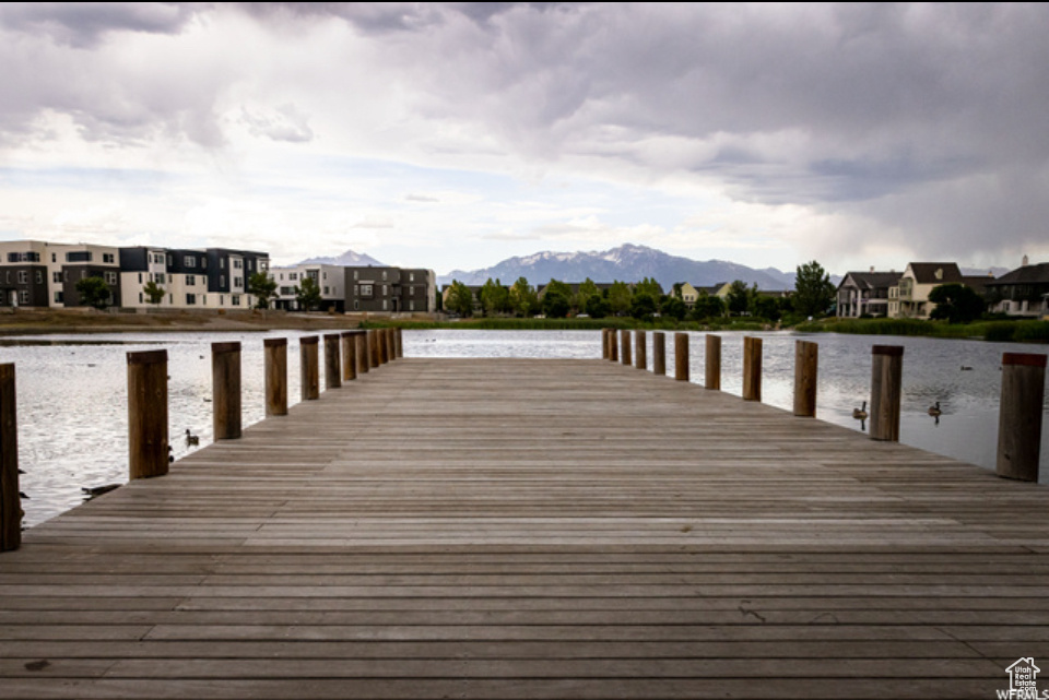 View of dock with a water and mountain view