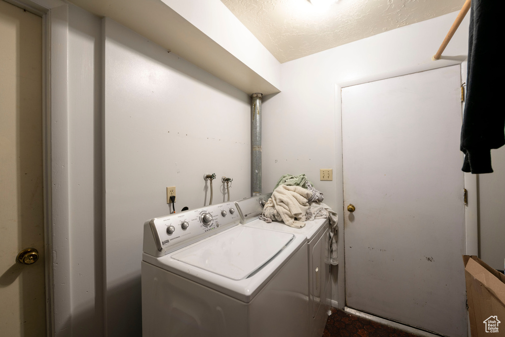 Washroom with washing machine and clothes dryer and hookup for a washing machine