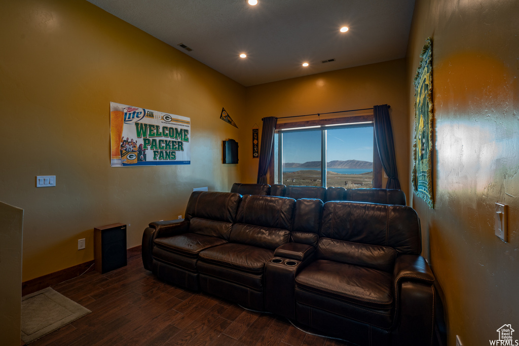 Living room with dark hardwood / wood-style flooring and a mountain view