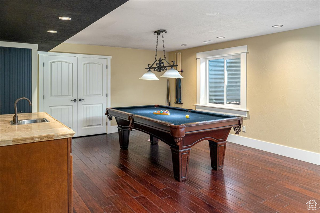 Game room featuring billiards, sink, and dark wood-type flooring