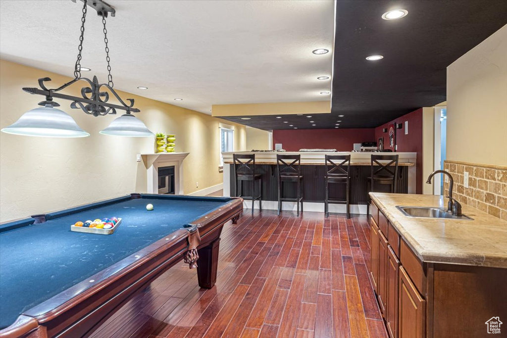 Rec room featuring dark wood-type flooring, sink, and billiards