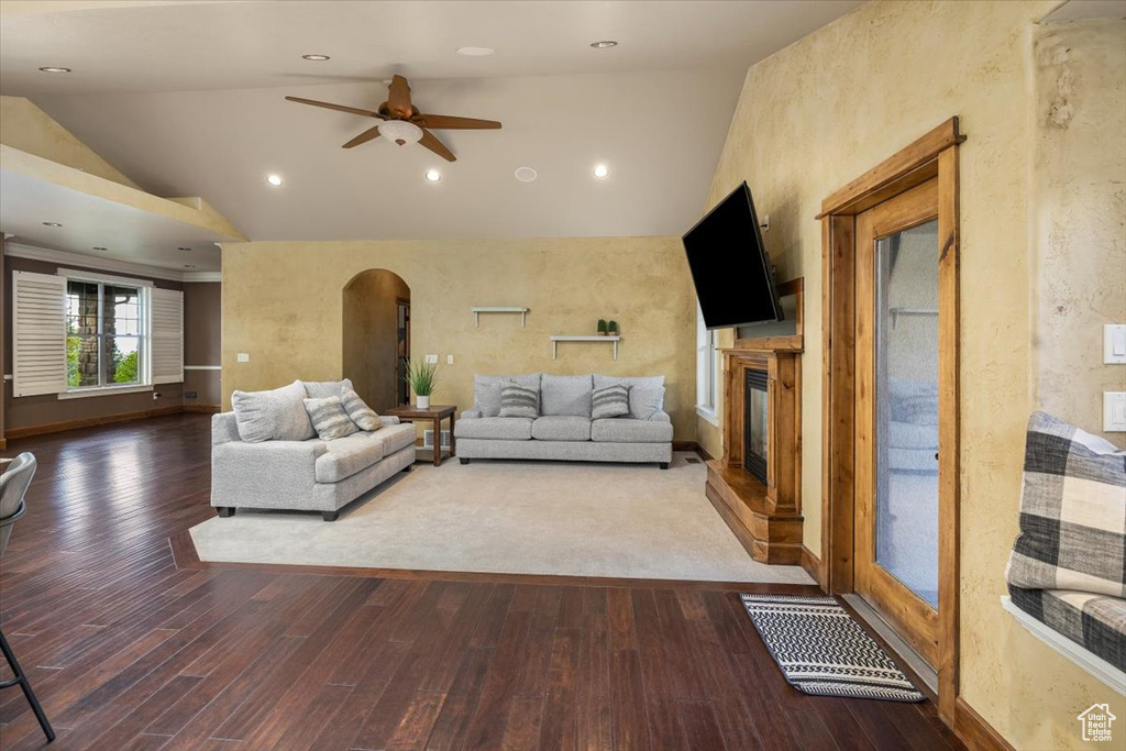 Unfurnished living room with high vaulted ceiling, ceiling fan, and hardwood / wood-style floors