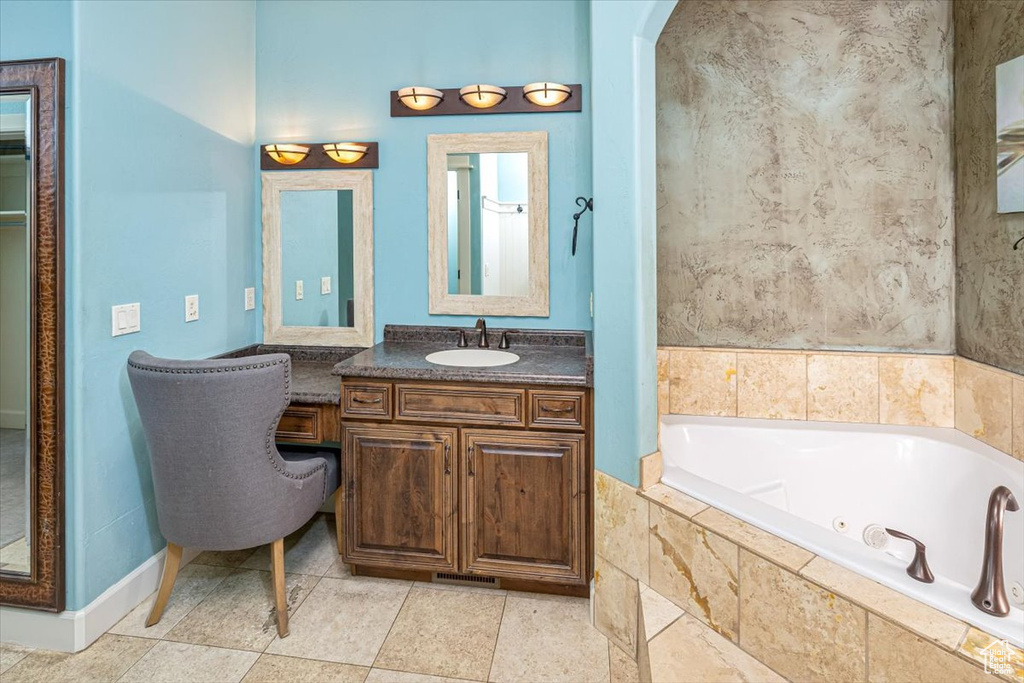 Bathroom featuring tile flooring and oversized vanity