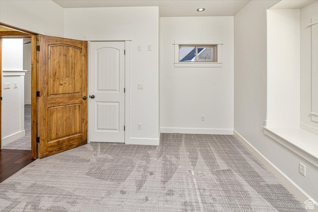 Unfurnished bedroom featuring hardwood / wood-style floors