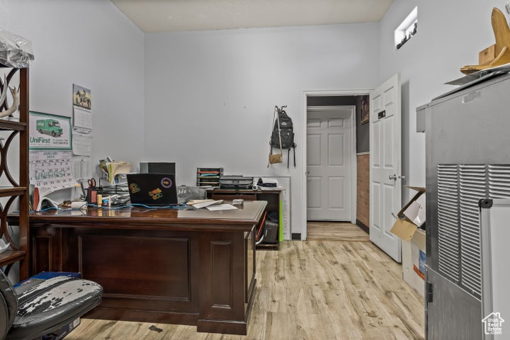 Office area featuring light hardwood / wood-style flooring