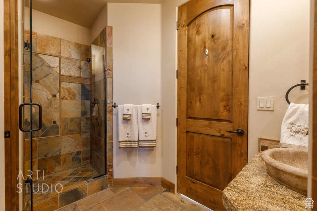 Bathroom featuring tile flooring and walk in shower