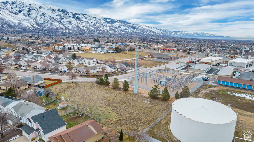 Birds eye view of property with a mountain view