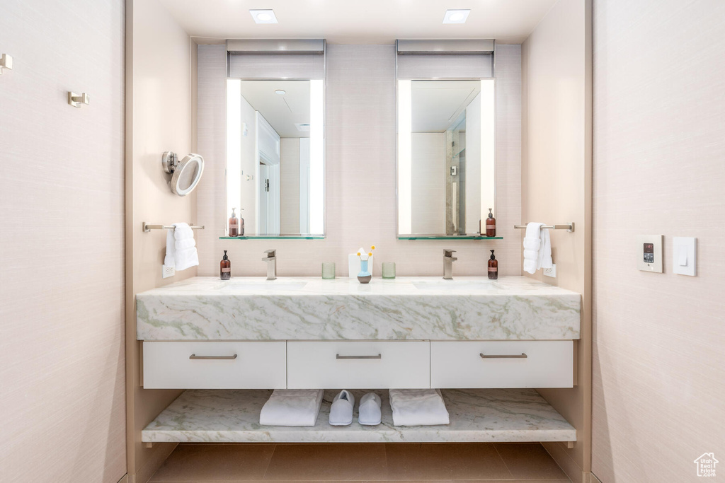 Bathroom with dual bowl vanity and tile floors