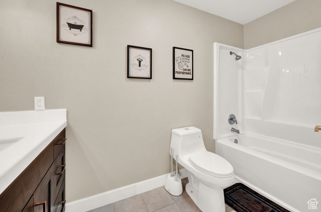 Full bathroom featuring vanity, toilet, shower / bathing tub combination, and tile flooring