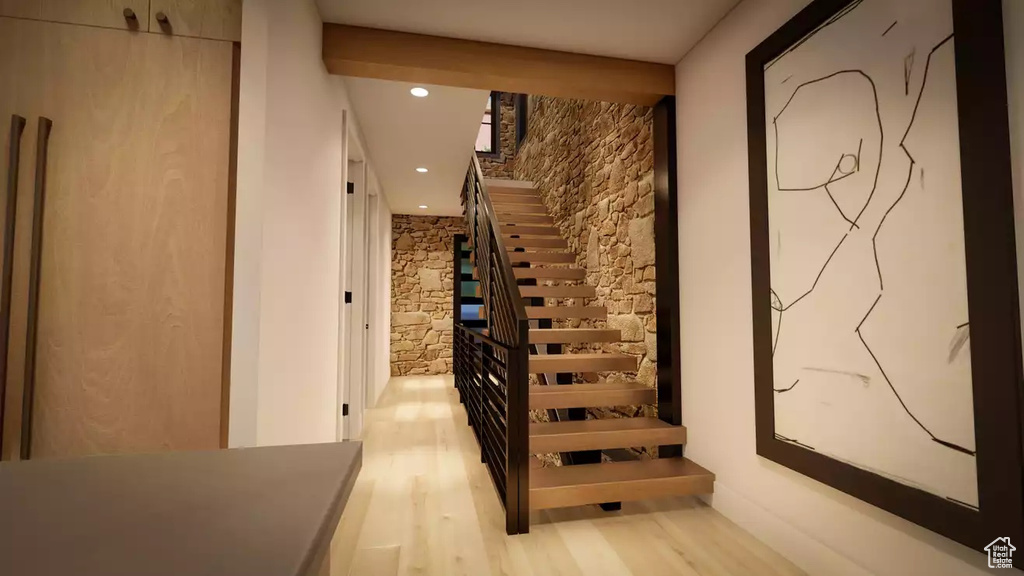 Staircase featuring light hardwood / wood-style floors