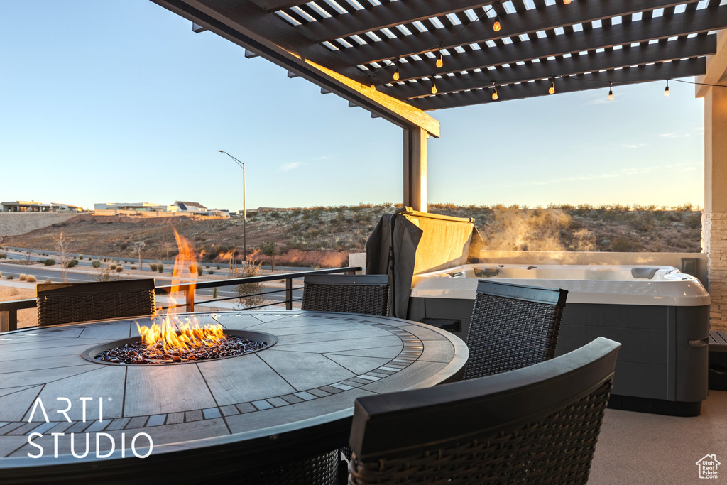 View of terrace featuring a pergola and an outdoor fire pit