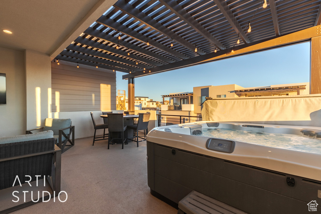 View of patio featuring a pergola and a hot tub