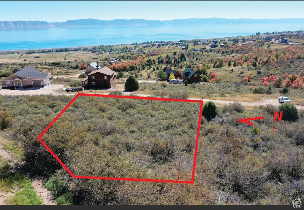 Birds eye view of property with a mountain view