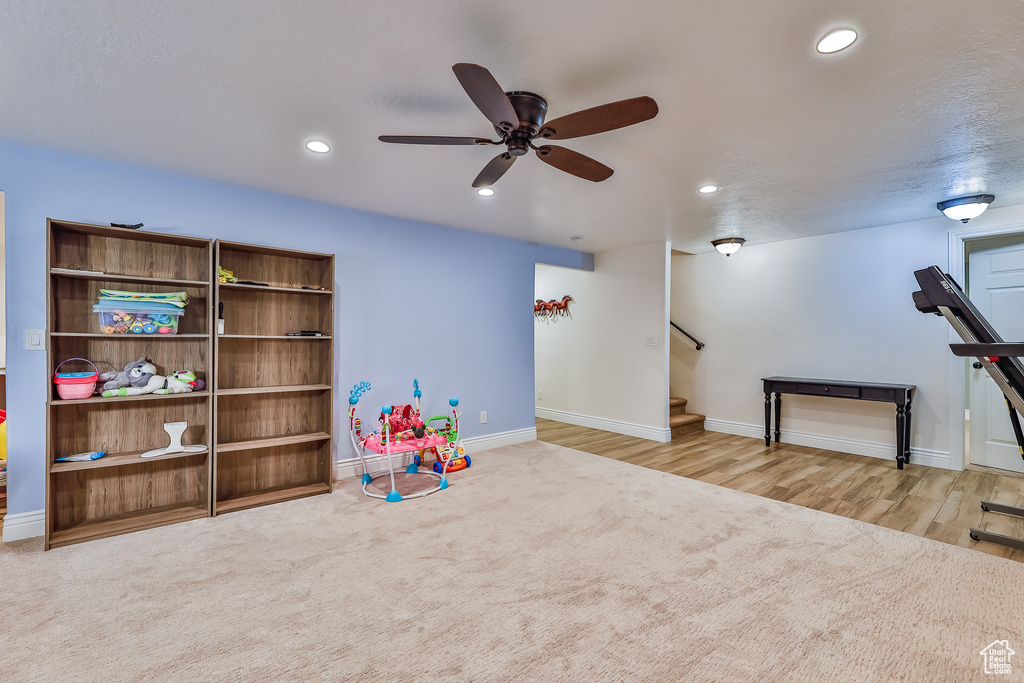 Rec room featuring ceiling fan and light carpet