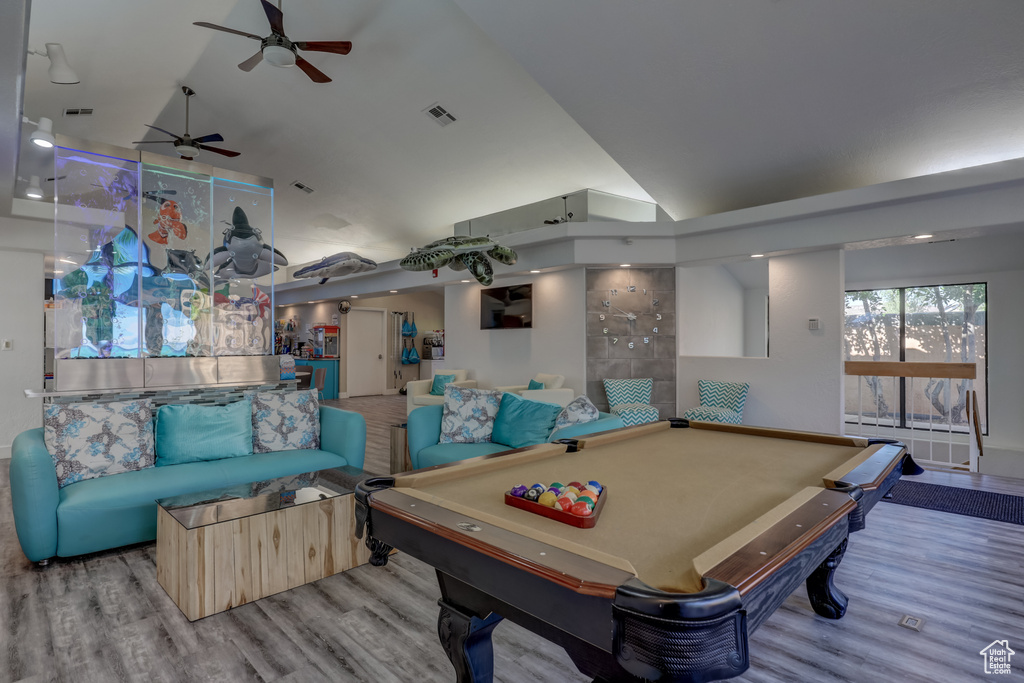 Rec room featuring light hardwood / wood-style flooring, pool table, ceiling fan, and high vaulted ceiling