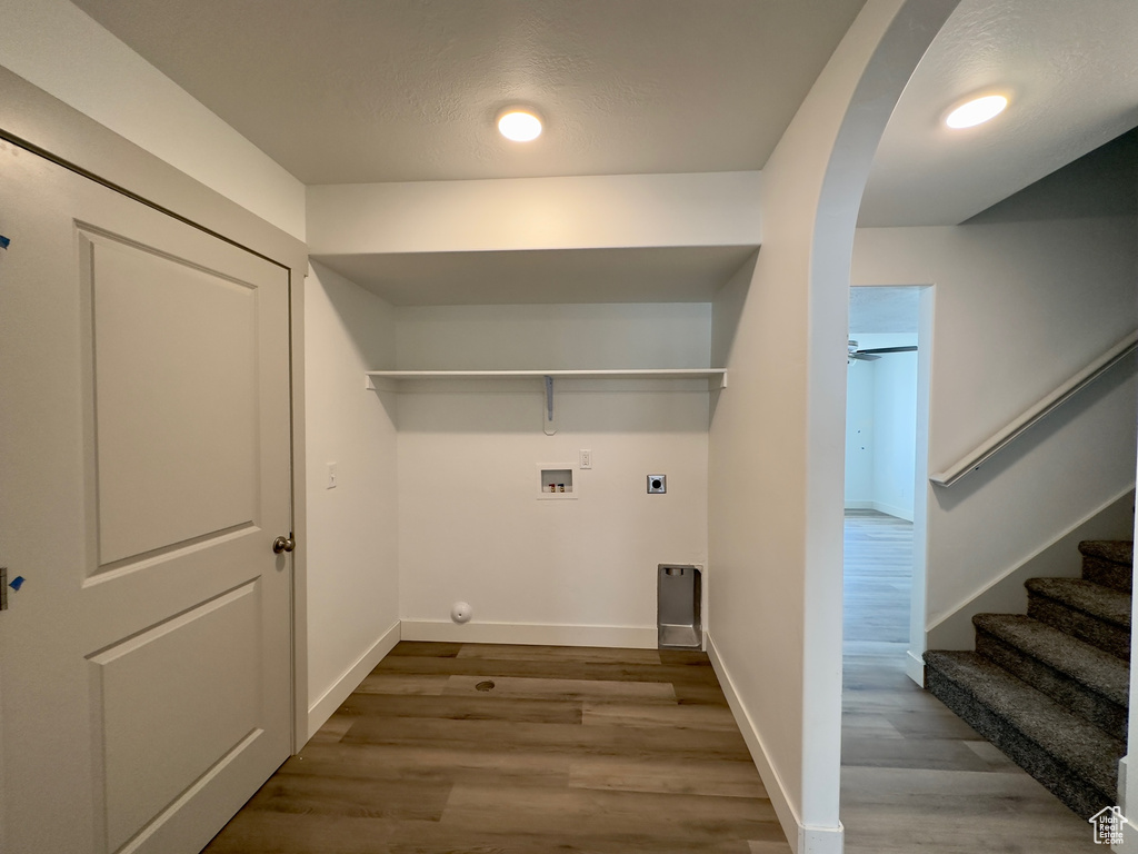 Laundry room with wood-type flooring, ceiling fan, electric dryer hookup, and washer hookup