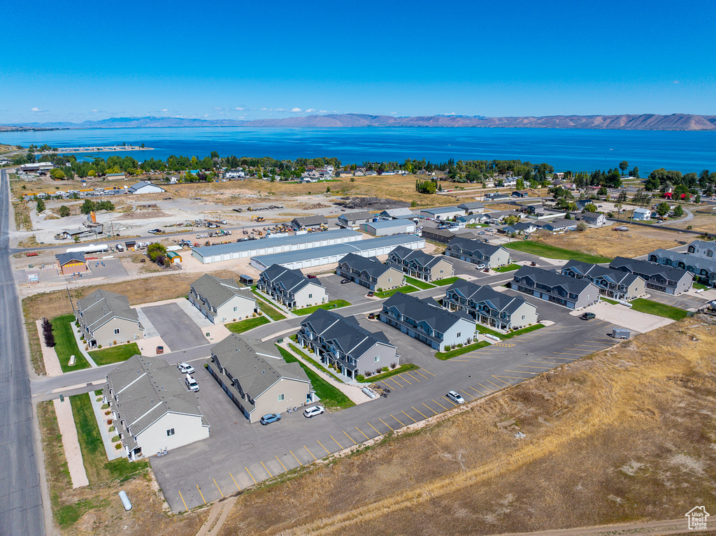 Drone / aerial view featuring a water and mountain view