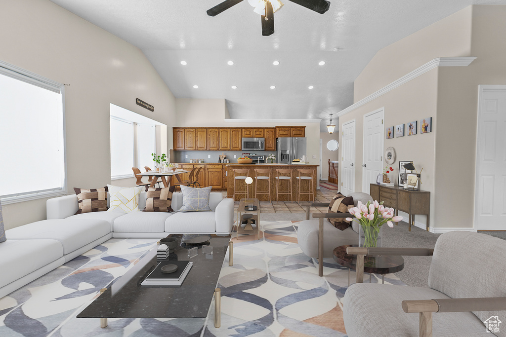 Tiled living room featuring high vaulted ceiling and ceiling fan