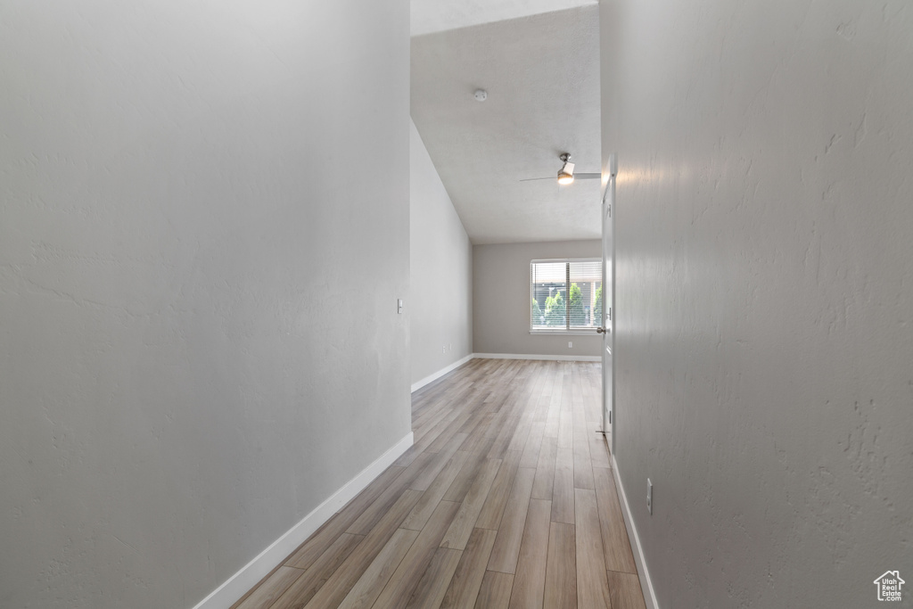 Corridor with light wood-type flooring