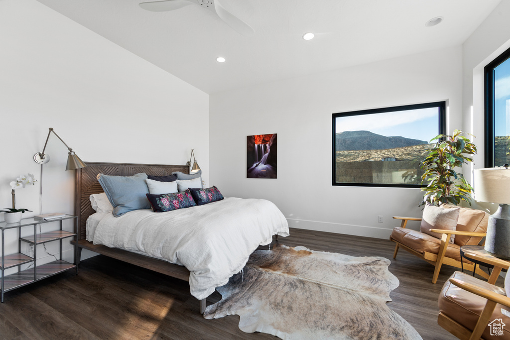 Bedroom featuring ceiling fan and dark wood-type flooring