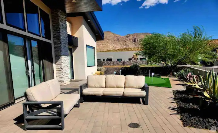 Exterior space featuring a mountain view and an outdoor living space