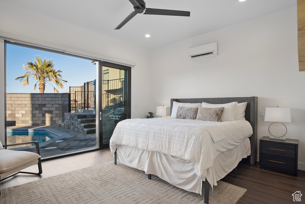 Bedroom featuring wood-type flooring, ceiling fan, a wall mounted air conditioner, and access to outside