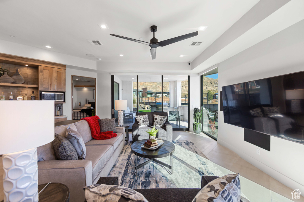 Living room featuring ceiling fan