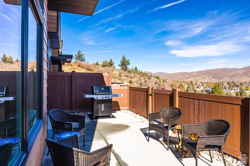 View of patio / terrace featuring a grill and a mountain view