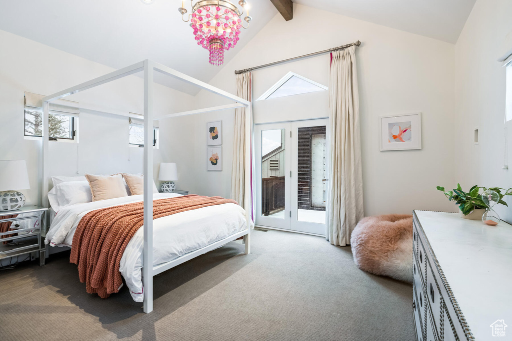 Bedroom with a notable chandelier, access to outside, carpet floors, and multiple windows