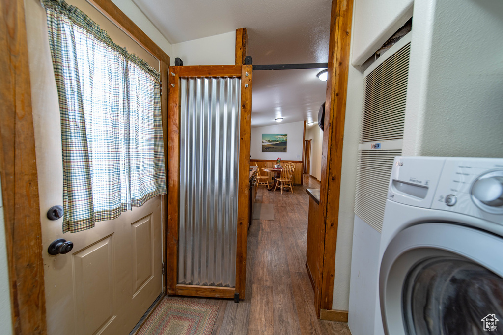 Laundry room with washer / clothes dryer and dark hardwood / wood-style flooring