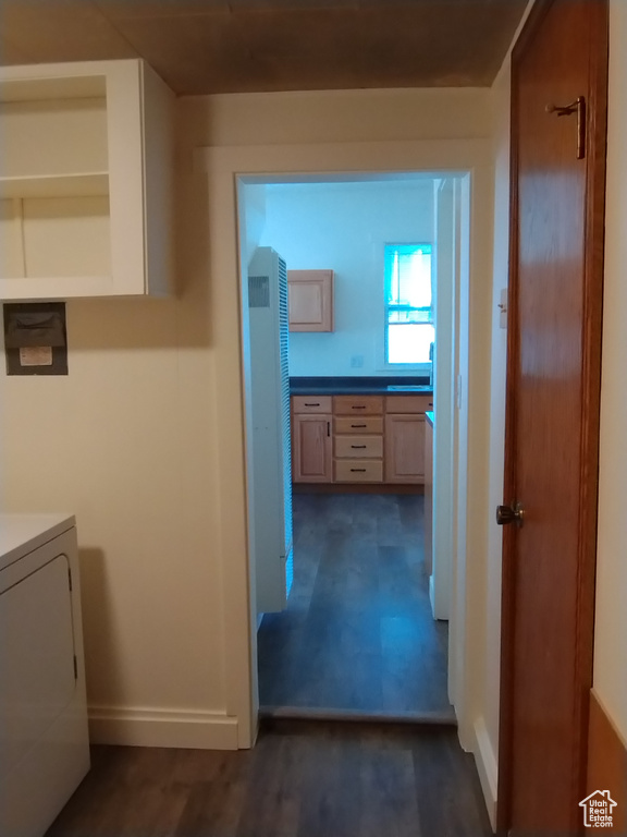 Hall featuring washer / clothes dryer and dark wood-type flooring