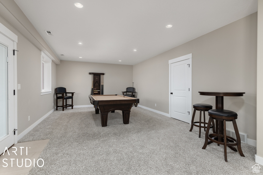 Rec room with light carpet and billiards