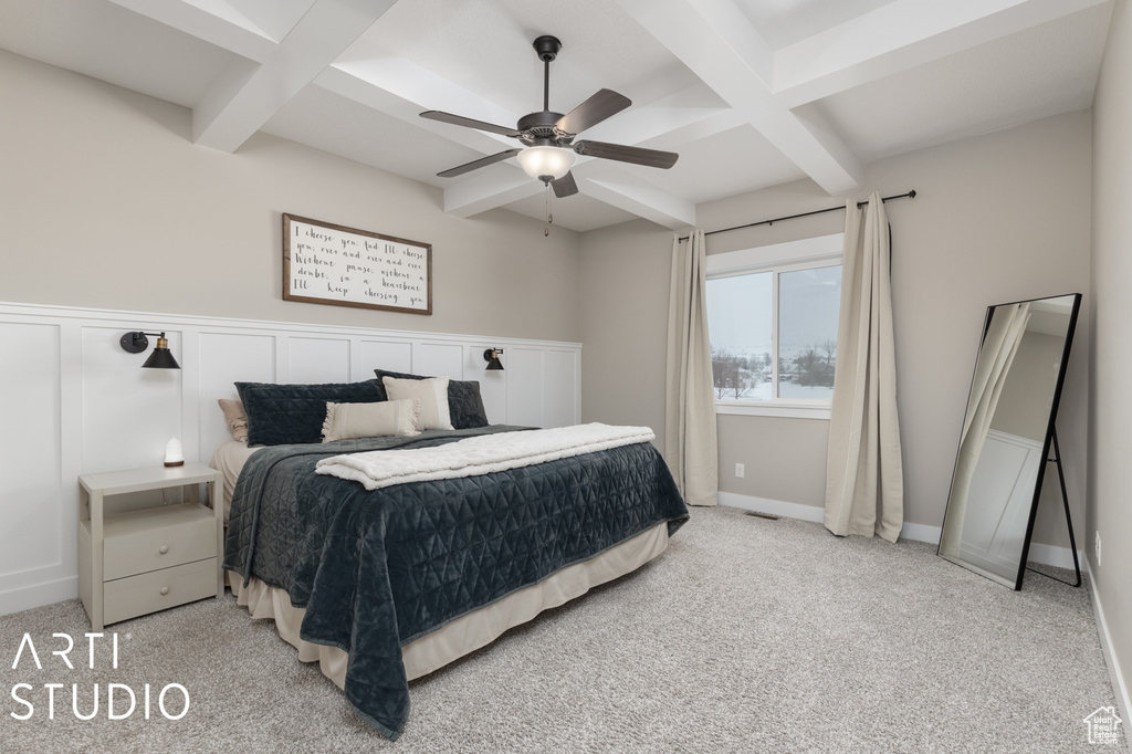 Bedroom featuring coffered ceiling, beamed ceiling, ceiling fan, and light carpet