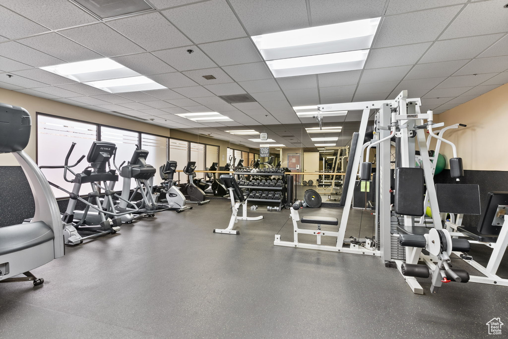 Workout area featuring a drop ceiling