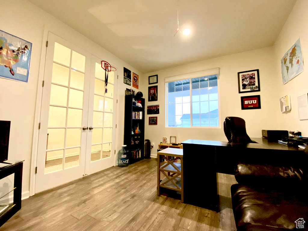 Office area featuring light hardwood / wood-style flooring and french doors