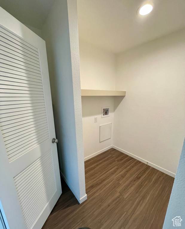 Laundry room featuring dark hardwood / wood-style floors and hookup for a washing machine