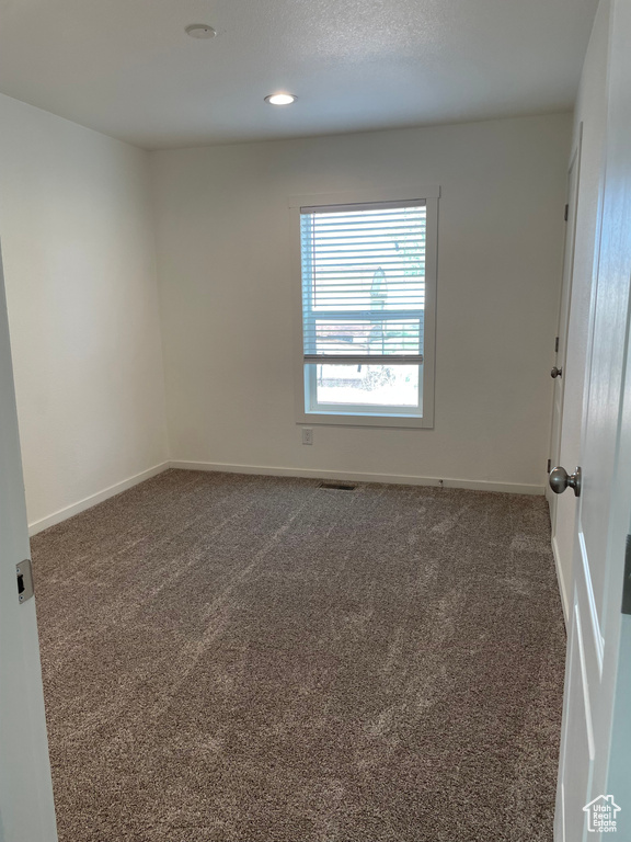 View of carpeted spare room