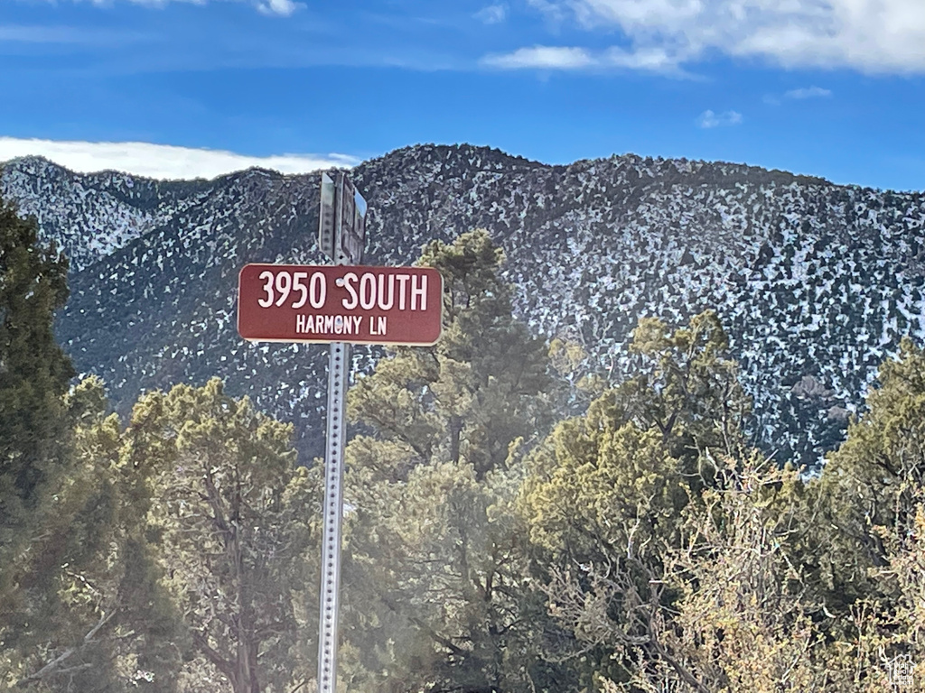 Community sign with a mountain view
