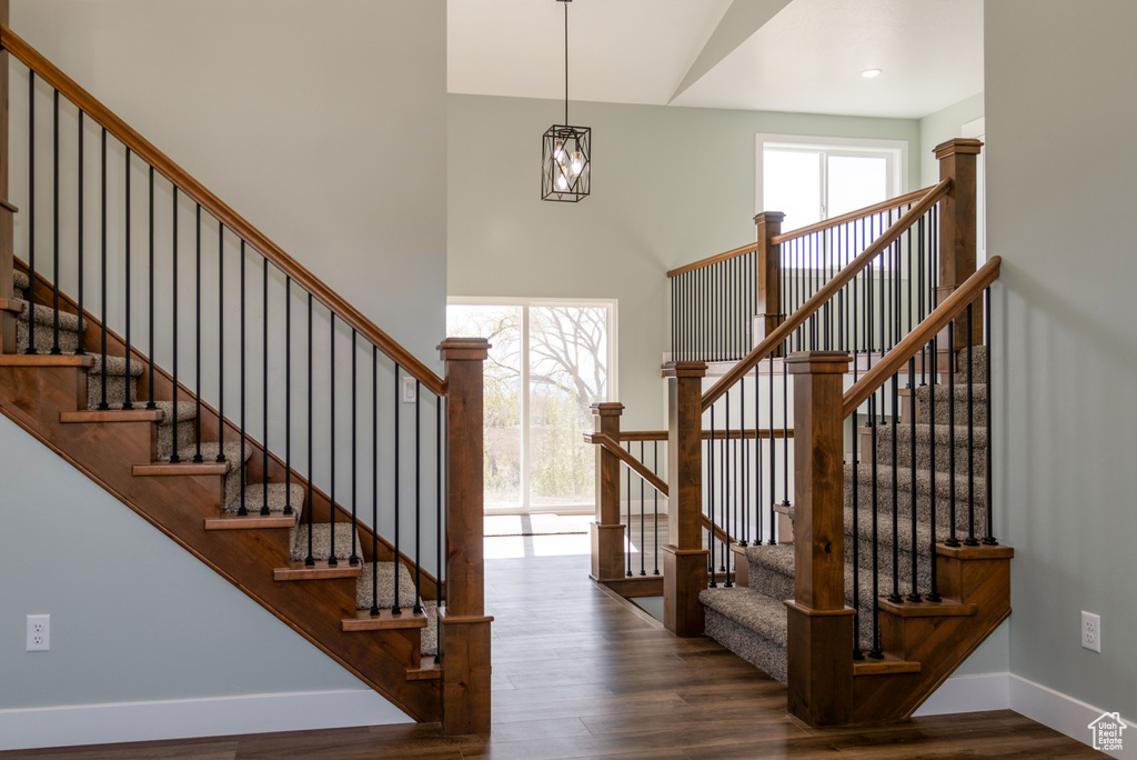 Stairway featuring dark hardwood / wood-style floors