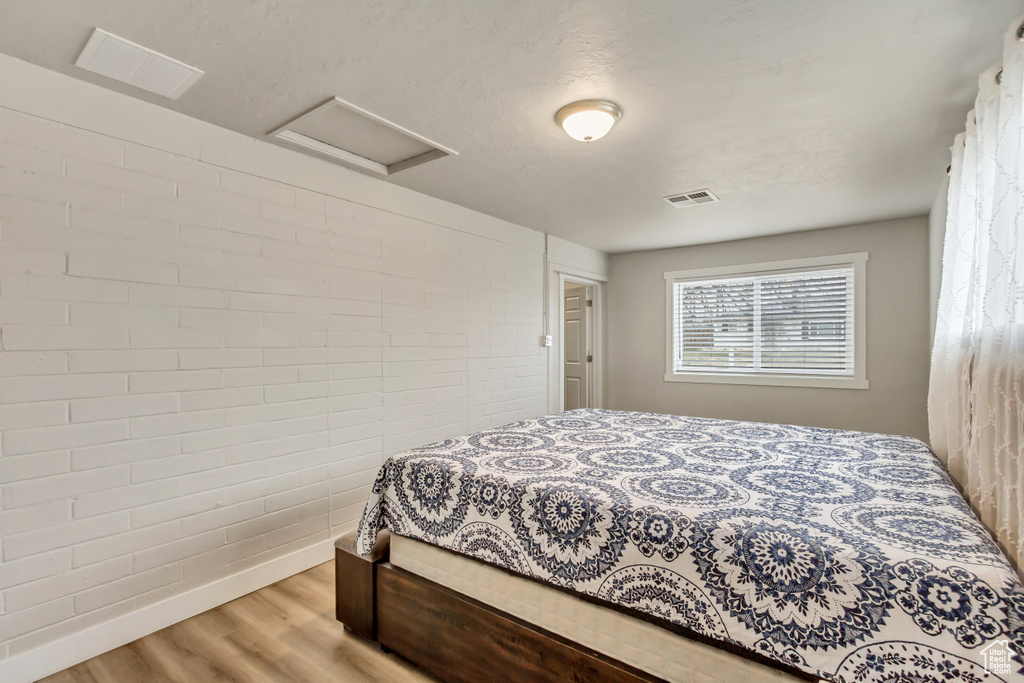 Bedroom with light wood-type flooring