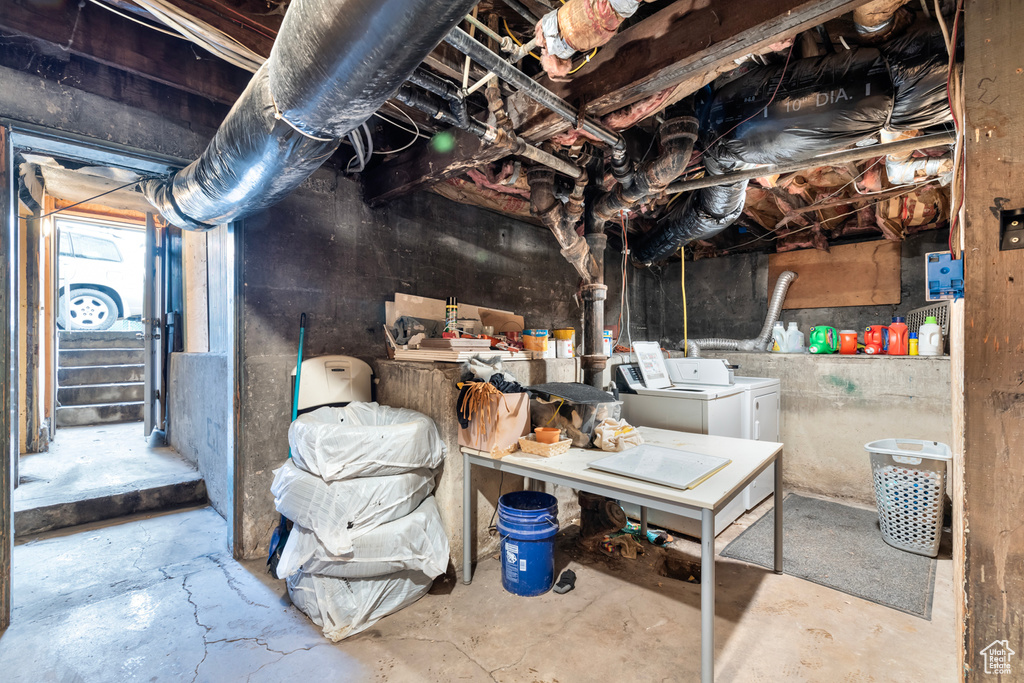 Basement featuring washer and clothes dryer