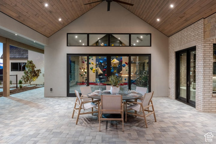 Dining space featuring french doors, high vaulted ceiling, ceiling fan, and wooden ceiling