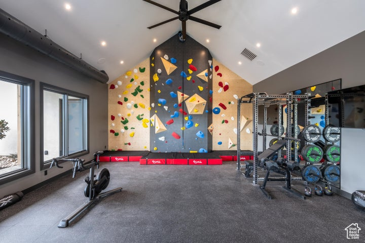 Gym with high vaulted ceiling and ceiling fan