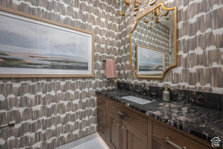 Bathroom featuring vanity and an inviting chandelier