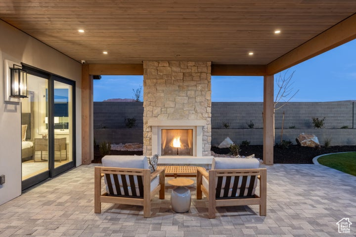 View of terrace featuring an outdoor living space with a fireplace