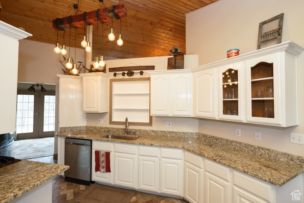 Kitchen featuring white cabinets, stainless steel dishwasher, dark parquet flooring, sink, and wood ceiling