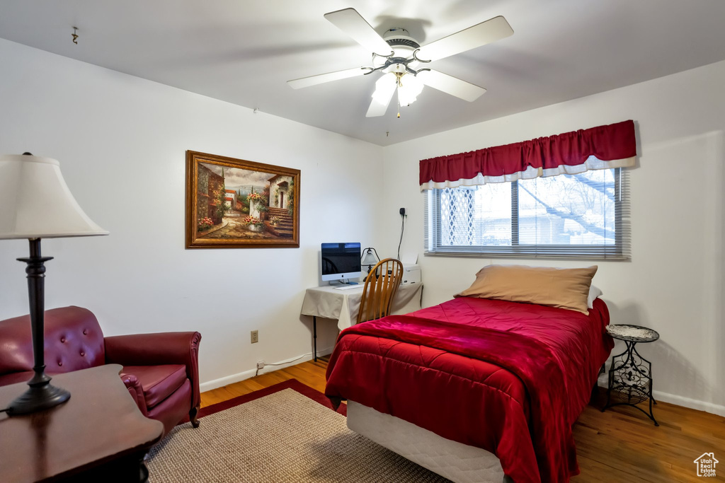 Bedroom featuring hardwood / wood-style flooring and ceiling fan