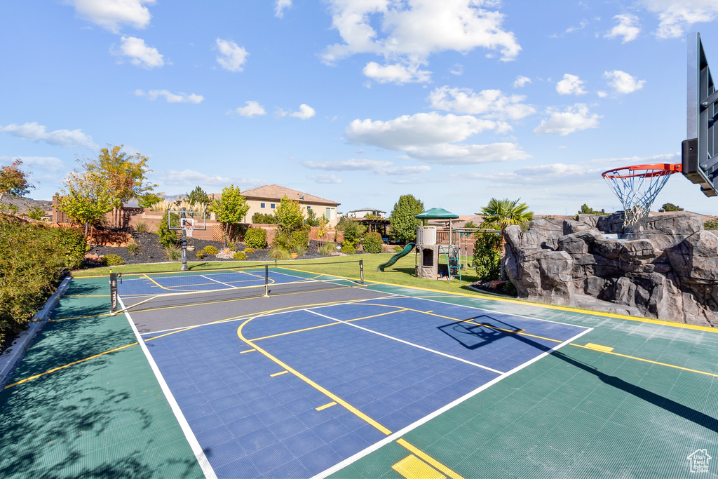 View of basketball court featuring a playground