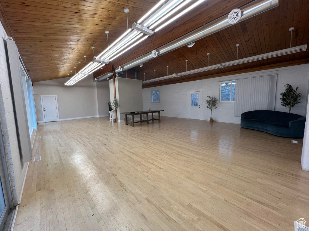 Interior space with light hardwood / wood-style floors and wooden ceiling